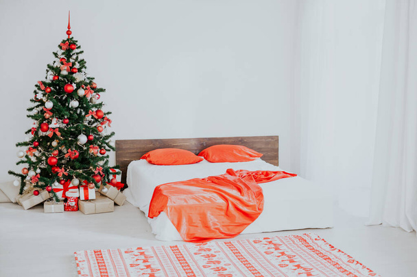 decor white bedroom with Christmas tree Christmas gifts Red - Φωτογραφία, εικόνα