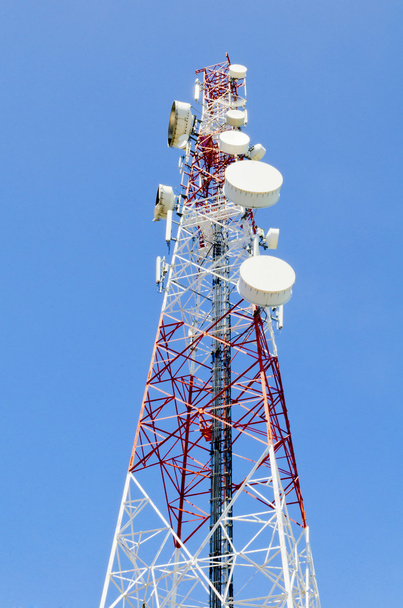 communications tower with antennas against blue sky - Photo, Image