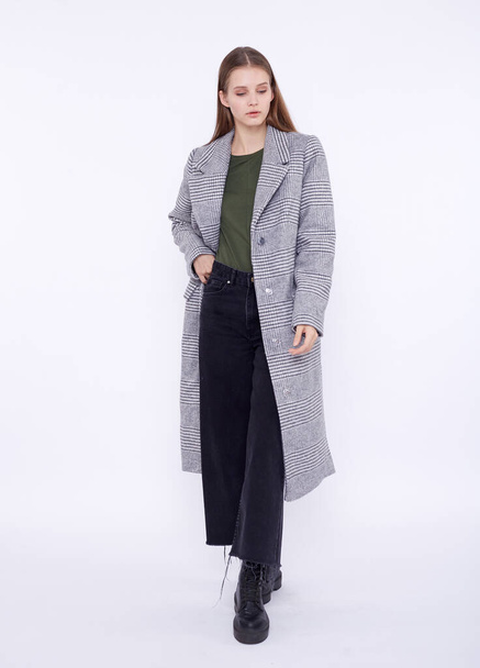 Beautiful fashion model in gray coat isolated on white background - Photo, Image