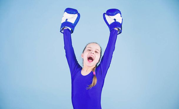 Female boxer change attitudes within sport. Rise of women boxers. Free and confident. Girl cute boxer on blue background. With great power comes great responsibility. Boxer child in boxing gloves - Photo, image