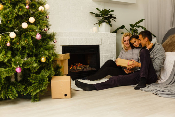 Happy family at home celebrating Christmas - Valokuva, kuva