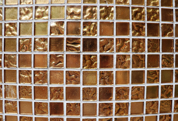 Golden glass mosaic tile exterior texture background - Foto, Imagen