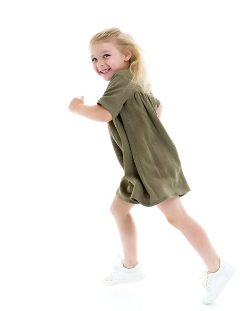 Cute little girl fun running around the room. Childrens games c - Foto, immagini