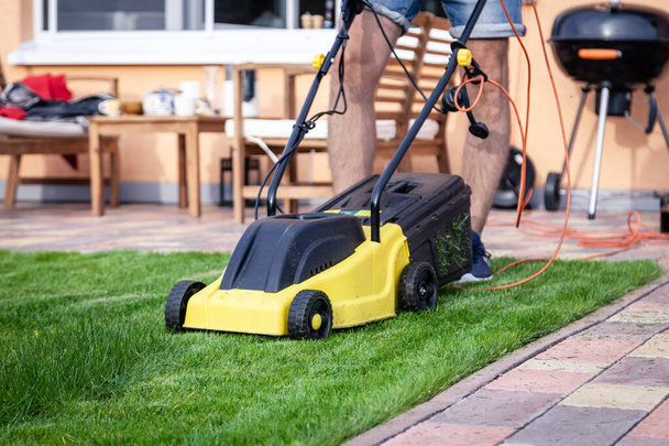 Lawn mower, green grass, equipment, mowing, gardener, care, work - Photo, Image