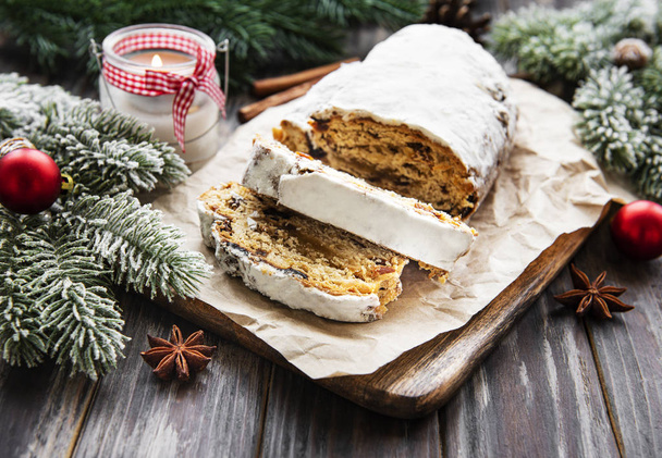 Christmas stollen on wooden background - Photo, Image