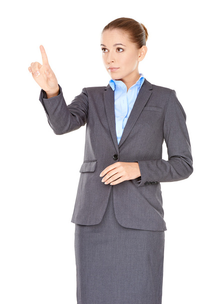 Businesswoman pointing and looking up - Φωτογραφία, εικόνα