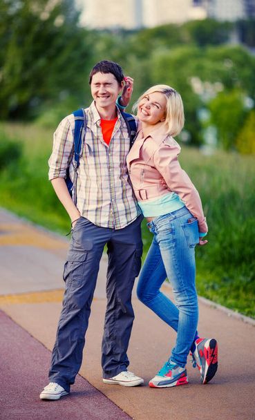 Photo of man with woman walking in park at summer - Foto, imagen