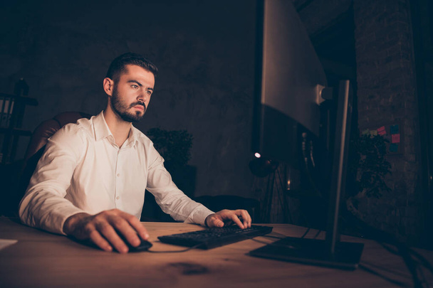Photo of entrepreneur in thoughts looking pensively into screen in search of consistant patterns browsing through different websites - Фото, изображение