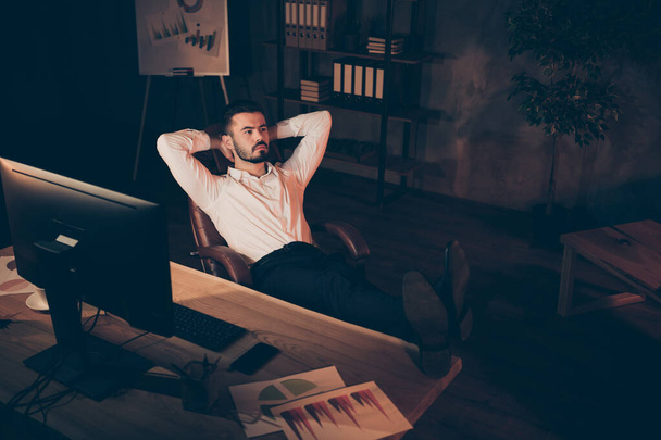 Full length body size top above high angle photo of serious confident pensive coach pondering over how not to become bankrupt and to reduce costs with legs on table - Fotografie, Obrázek