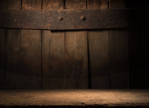 Old wooden barrel on a brown background - Fotografie, Obrázek