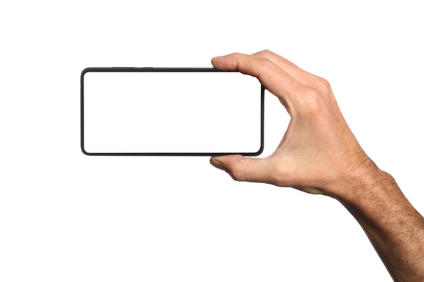 uomo maschio in possesso e mostrando smart phone vuoto isolato su sfondo bianco con percorso di ritaglio intorno a mano e visualizzare con spazio di copia per il testo
 - Foto, immagini