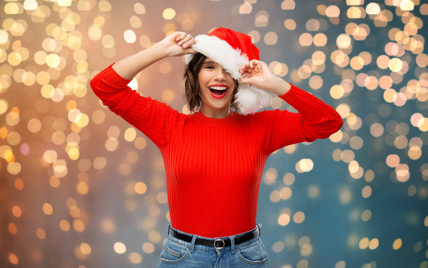 happy young woman in santa hat on christmas - Photo, image
