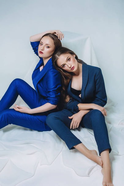 young beautiful women in blue suits - Photo, Image