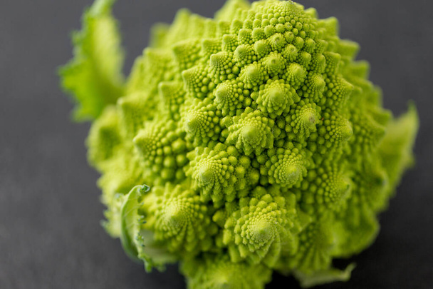 close up of romanesco broccoli on table - Foto, afbeelding
