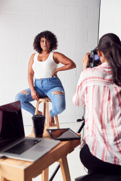 Model Posing For Female Photographer In Studio Portrait Session - Zdjęcie, obraz
