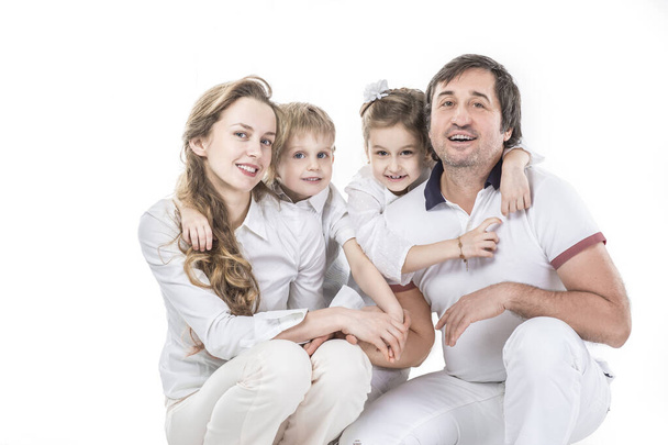 family portrait: parents with daughter and son on white background - Фото, зображення