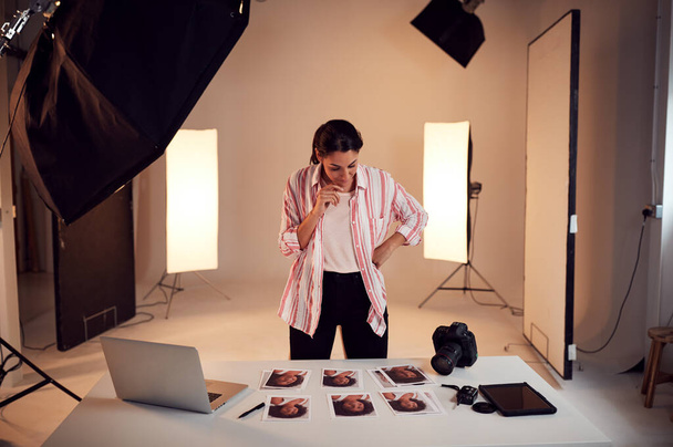 Female Photographer Editing Images From Photo Shoot In Studio - Fotó, kép