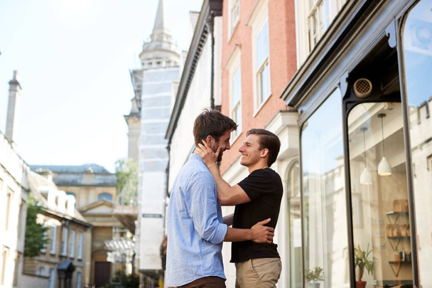 Loving Male Gay Couple Hugging Outside In City Street - Foto, Imagem