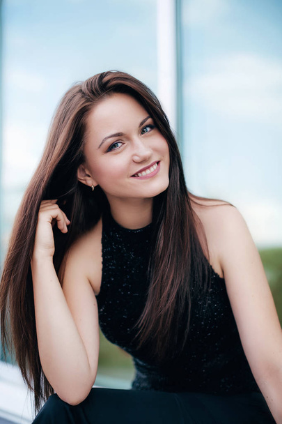 portrait of  beautiful young woman in black top - Foto, afbeelding