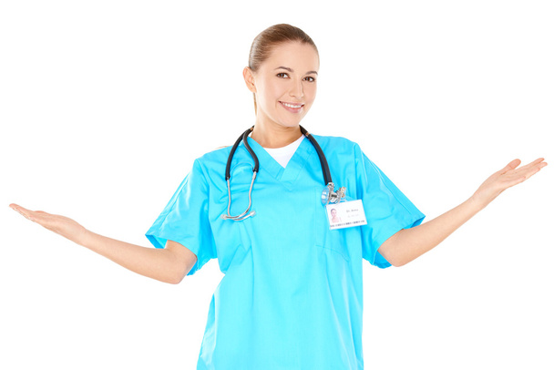 uśmiechnięta kobieta lekarz podnoszenie jej ręce - Zdjęcie, obraz