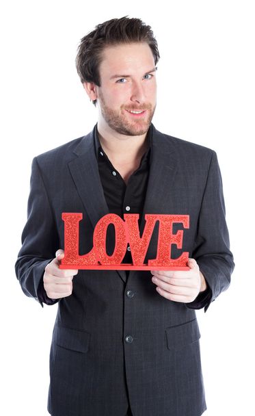 attraktive kaukasische Geschäftsmann mit einem Zeichen der Liebe - Foto, Bild