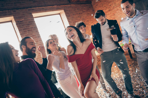 Photo of eight friends dance floor spending x-mas students party together little drunk alcohol bar crazy dancing wear formalwear red dress shirts restaurant indoors - 写真・画像