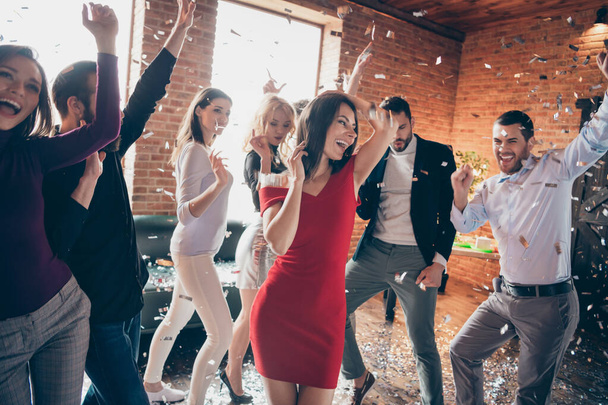 Photo of celebrating group corporate company dance floor raise hands birthday party confetti falling wear formalwear dresses shirts restaurant place indoors - Fotoğraf, Görsel