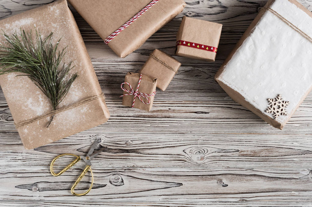 Handmade gifts made from craft paper christmas rope and tree on the rustic wood planks background. DIY. - Fotoğraf, Görsel