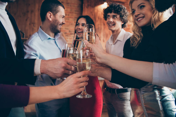 Cropped photo of cheerful positive charming people having gathered to celebrate their friend birthday clinking their glasses indoors - Fotoğraf, Görsel