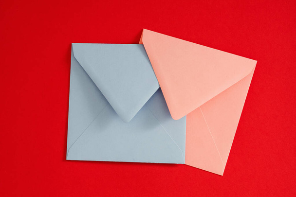 romantic mail blue pink envelopes red background - Φωτογραφία, εικόνα