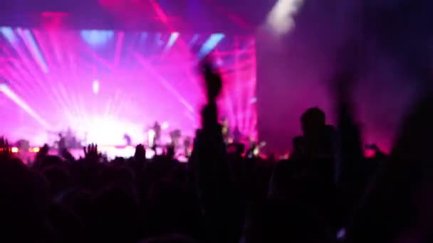 Crowd at concert raising her hands up and applauds - Footage, Video