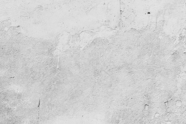 textura betonové stěny s prasklinami a škrábanci, které lze použít jako pozadí - Fotografie, Obrázek