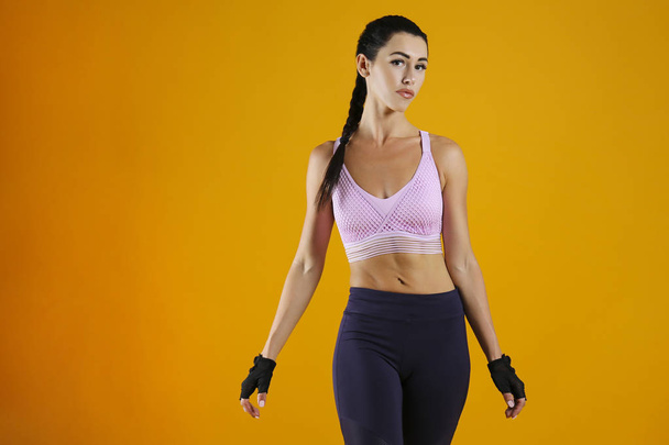 Colorful shot of young beautiful woman in great shape. Sporty lifestyle concept. - 写真・画像