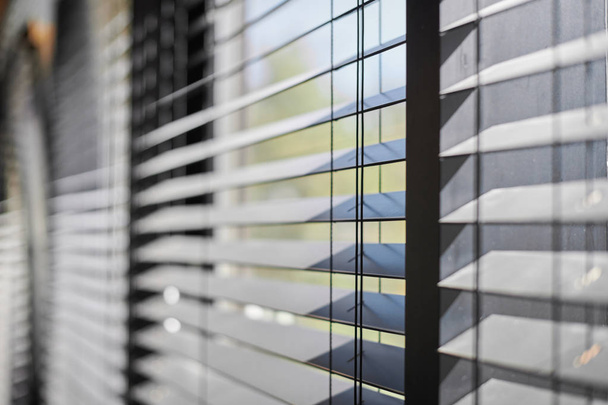 Office blinds. Modern wooden jalousie. Office meeting room lighting range control. - Photo, Image