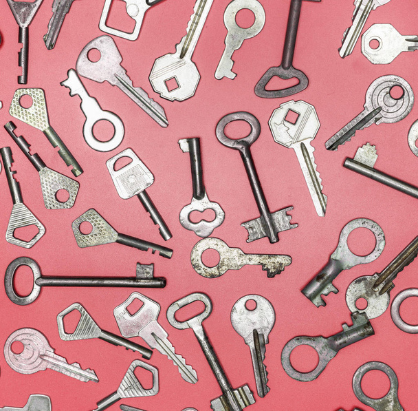 Keys set on pink background. Door lock keys and safes for proper - Photo, Image