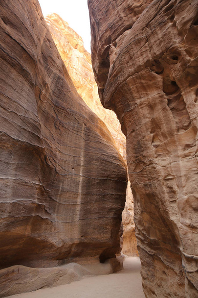 Path through the Siq, which is the narrow gorge passage that you walk along to reach Petra, Jordan. - Photo, Image
