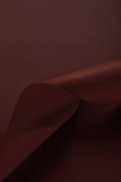 Abstract silk ribbon on chocolate background, exclusive luxury b - Фото, зображення