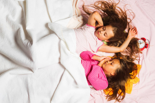 Childhood, night and happiness concept. Children with closed eyes - Valokuva, kuva