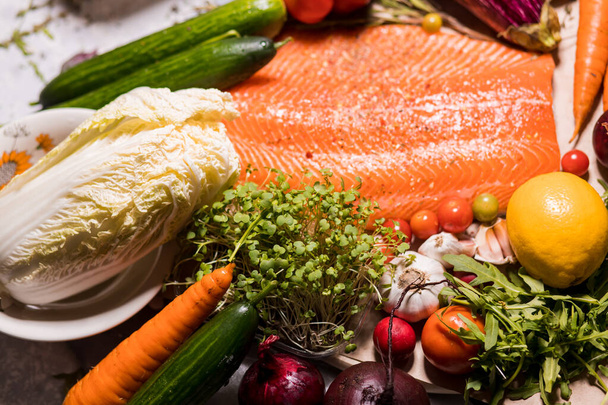 Fresh salmon fillet with vegetables on the table - Photo, Image