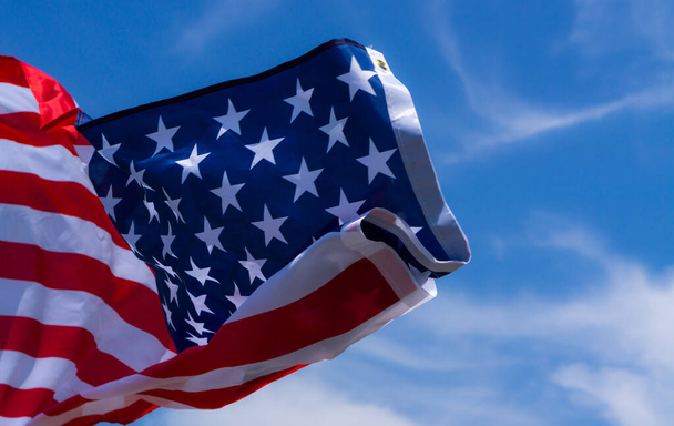 US American flag on blue sky background. For USA Memorial day, V - Photo, Image