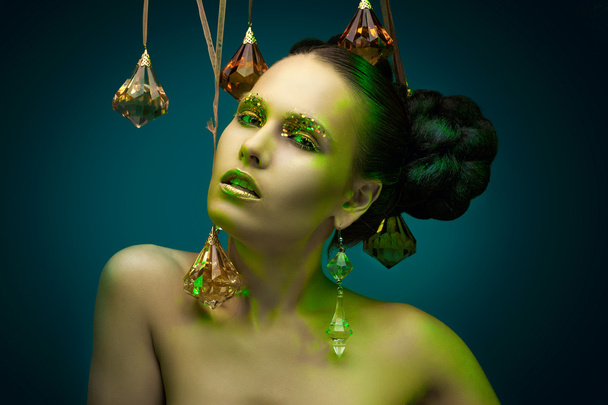 beauty portrait in glass pendants. - Photo, image