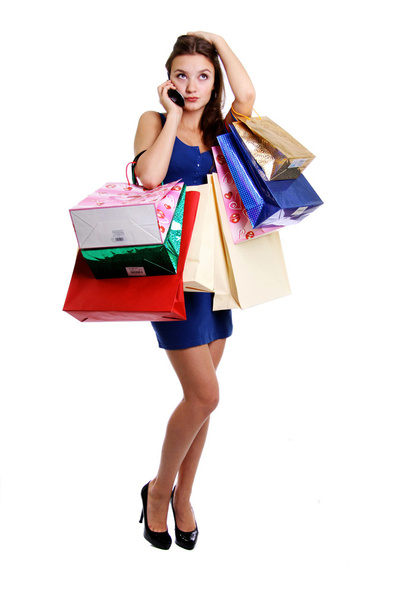 Happy young adult woman with colored bags - Foto, Bild