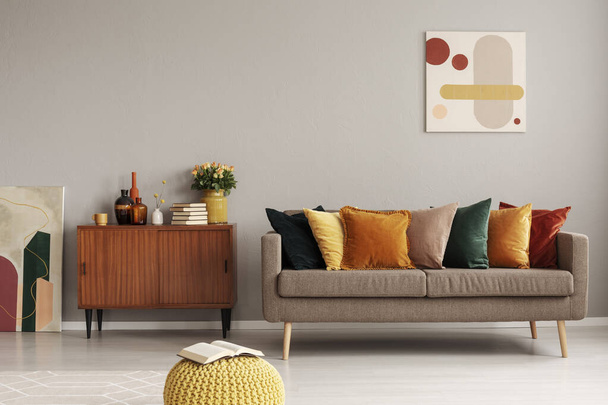 Retro style in beautiful living room interior with grey empty wall - Фото, зображення