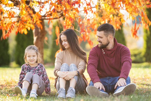 family with daughter walks in autumn park - Foto, immagini