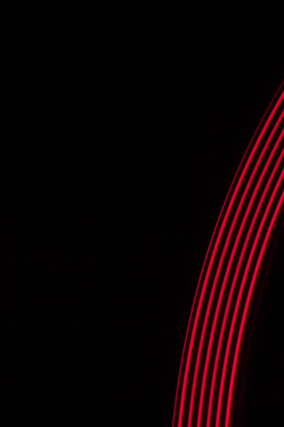 red light lines on a black background - Foto, imagen