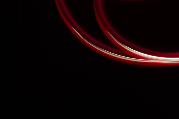 red light lines on a black background - Foto, Imagem