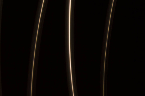 gold  light lines on a black background - Fotó, kép