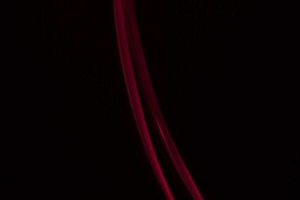 red light lines on a black background - Foto, Imagen