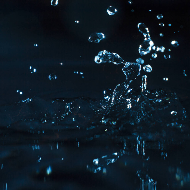water splashes on a dark background - Valokuva, kuva