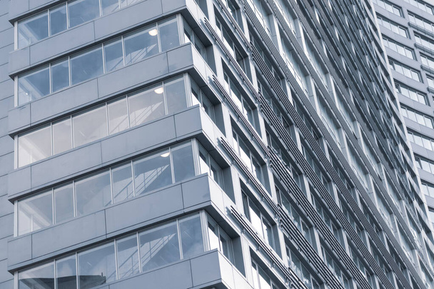 A part of abstract modern office building, skyscraper close up background - Fotó, kép